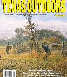 Hunter aims rifle over a fence in tall grass near trees on a cloudy day.