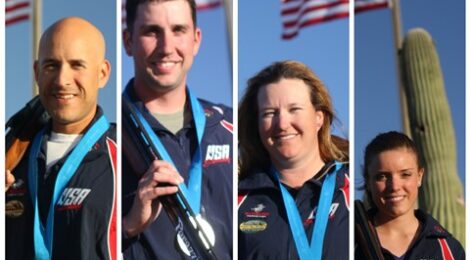 Four medalists with American flags and medals.
