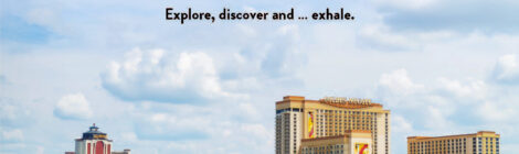 Kayakers enjoy Lake Charles with city skyline views on a clear day.