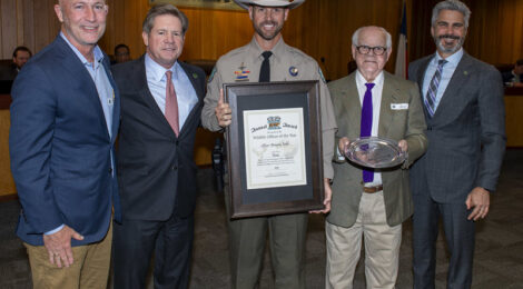 Group of men with award and plaque.