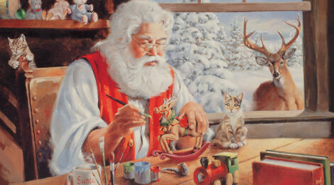 Santa Claus painting Christmas ornaments with a rabbit nearby.